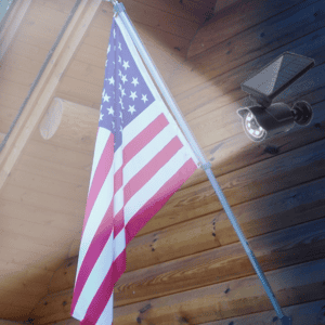 flagpole fix on the wall of the house