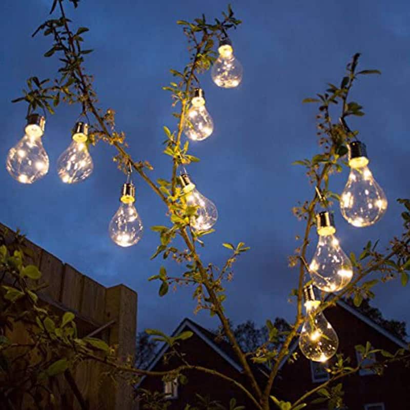 solar colorful light bulb hanging on tree